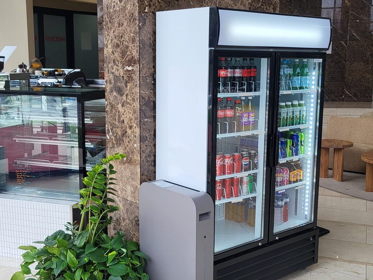 ELIoT battery installed beside a beverage cooler in a building lobby