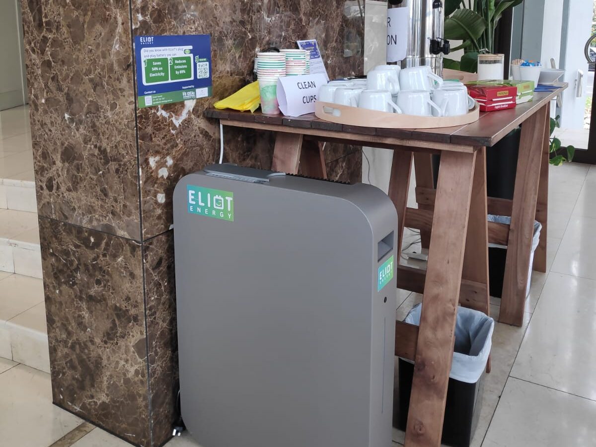 ELIoT battery unit installed unobtrusively beside a table at an office morning tea event