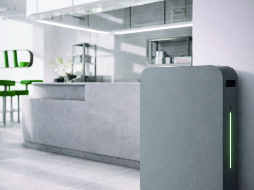 The ELIoT plug-and-play battery unit installed in a modern café, with its status LED glowing green